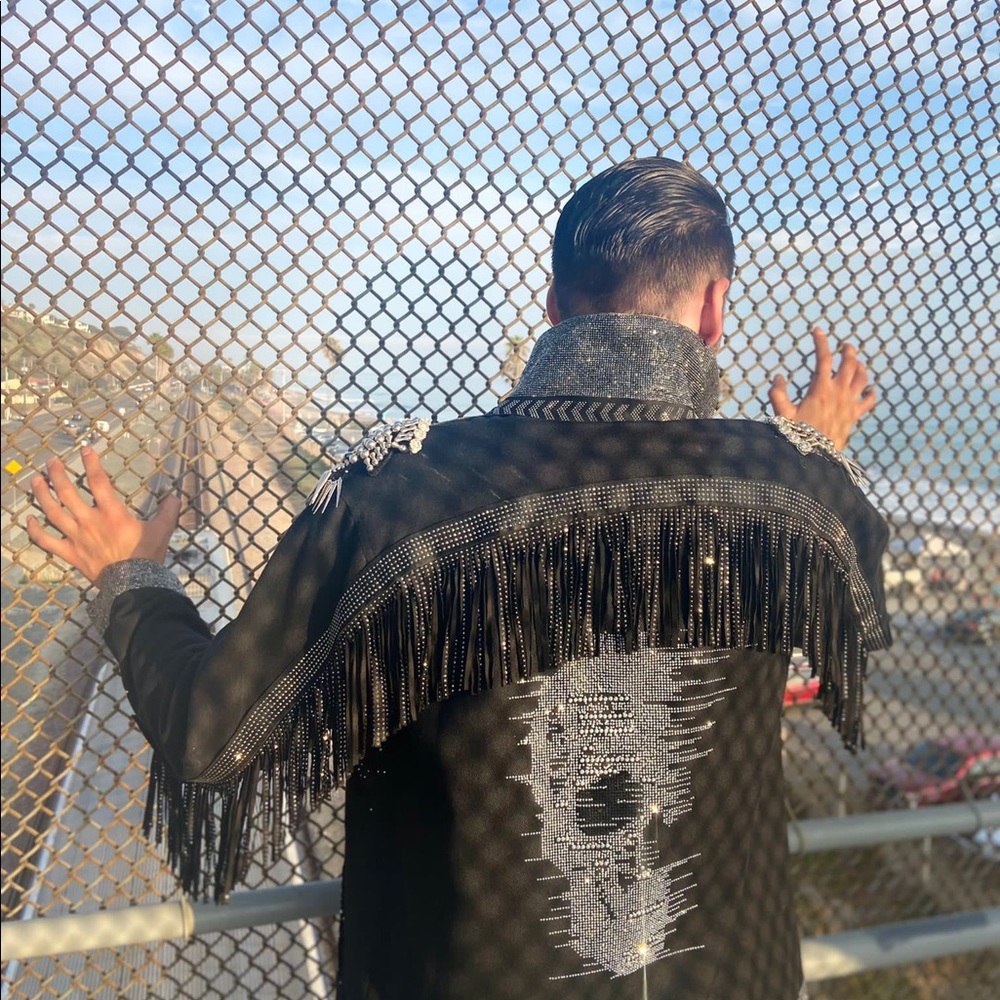 men's jacket on the lining finished with sequins, fringes and metal decorations